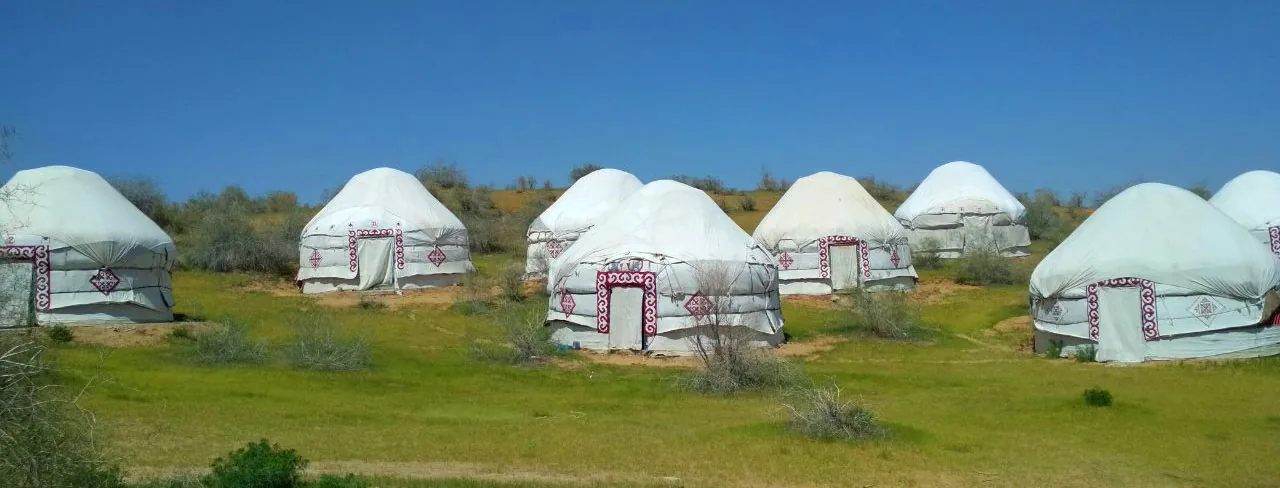 Traditional felt yurts at a desert camp near Aydarkul Lake, Uzbekistan